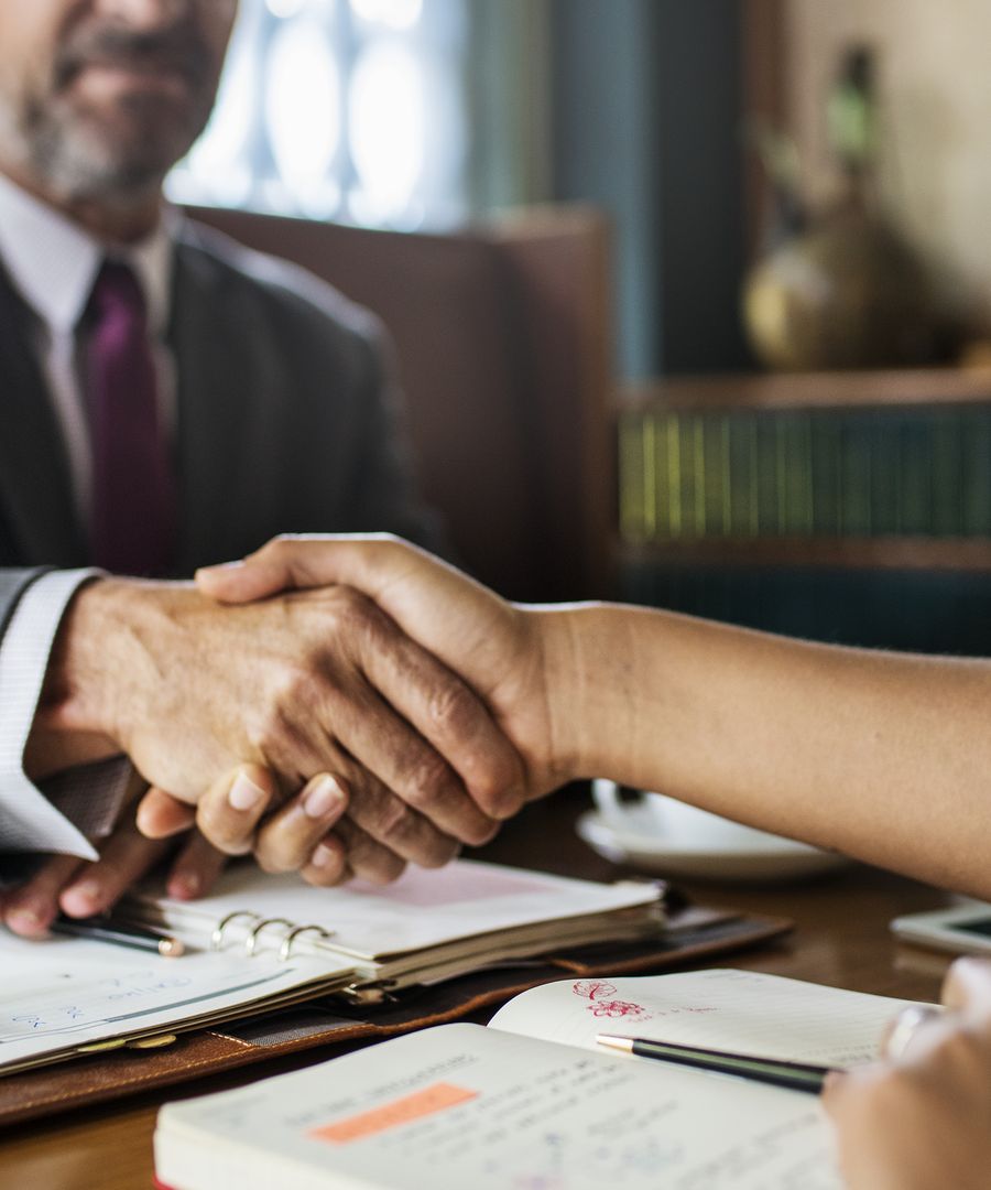 An attorney meeting with a client at Coyne, Cundiff & Hillemann, P.C.